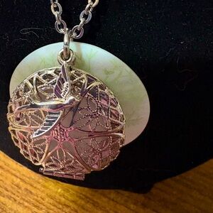 N14 17” silver tone locket, swallow charm and shell tree pendant